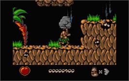 In game image of Chuck Rock on the Atari ST.