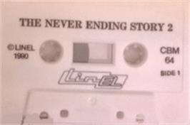 Cartridge artwork for Neverending Story 2, The - The Arcade Game on the Commodore 64.