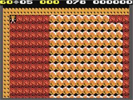 In game image of Cheech And Chongs Boulder Dash 2 on the Commodore 64.