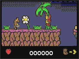 In game image of Chuck Rock on the Commodore 64.