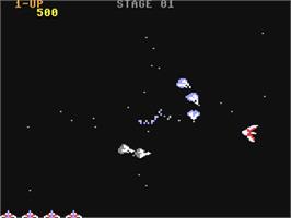In game image of Gyruss on the Commodore 64.