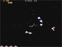 In game image of Gyruss on the Commodore 64.