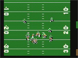 In game image of John Madden Football on the Commodore 64.