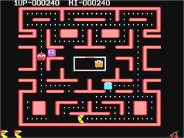 In game image of Ms. Pac-Man on the Commodore 64.