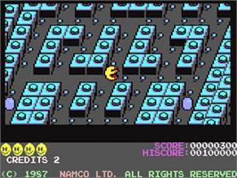 In game image of Pac-mania on the Commodore 64.
