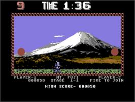 In game image of Pang on the Commodore 64.