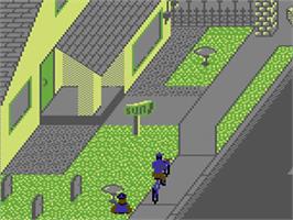 In game image of Paperboy on the Commodore 64.