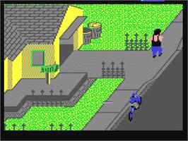 In game image of Paperboy on the Commodore 64.