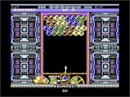 In game image of Puzzle Bobble on the Commodore 64.