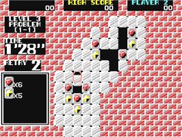 In game image of Puzznic on the Commodore 64.
