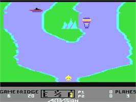 In game image of River Raid on the Commodore 64.