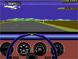 In game image of Test Drive II Car Disk: Musclecars on the Commodore 64.