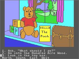 In game image of Winnie the Pooh in the Hundred Acre Wood on the Commodore 64.