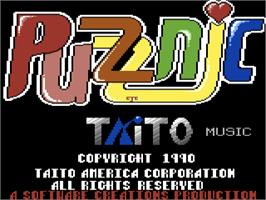 Title screen of Puzznic on the Commodore 64.