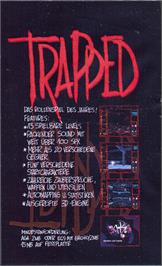 Box back cover for Trapped on the Commodore Amiga.