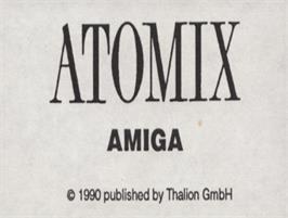 Top of cartridge artwork for Atomix on the Commodore Amiga.