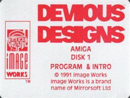 Top of cartridge artwork for Devious Designs on the Commodore Amiga.