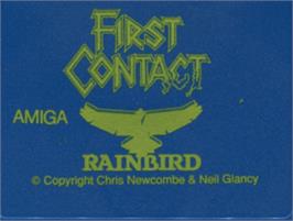 Top of cartridge artwork for First Contact on the Commodore Amiga.
