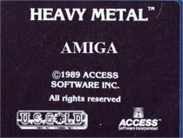 Top of cartridge artwork for Heavy Metal on the Commodore Amiga.