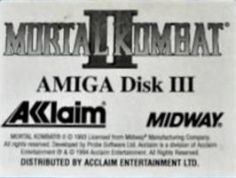 Top of cartridge artwork for Mortal Kombat 2 on the Commodore Amiga.