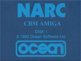 Top of cartridge artwork for Narc on the Commodore Amiga.