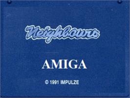 Top of cartridge artwork for Neighbours on the Commodore Amiga.