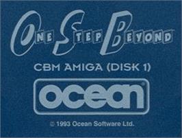 Top of cartridge artwork for One Step Beyond on the Commodore Amiga.