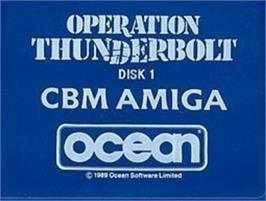 Top of cartridge artwork for Operation Thunderbolt on the Commodore Amiga.