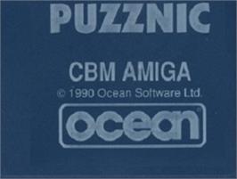 Top of cartridge artwork for Puzznic on the Commodore Amiga.
