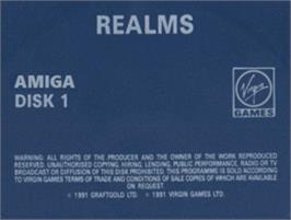 Top of cartridge artwork for Realms on the Commodore Amiga.