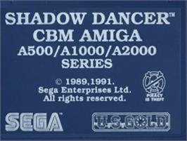 Top of cartridge artwork for Shadow Dancer on the Commodore Amiga.