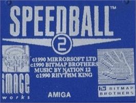 Top of cartridge artwork for Speedball 2: Brutal Deluxe on the Commodore Amiga.