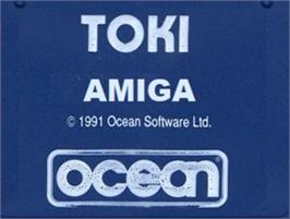 Top of cartridge artwork for Toki on the Commodore Amiga.