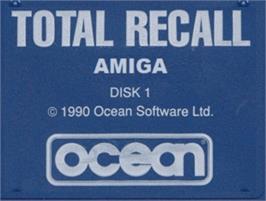 Top of cartridge artwork for Total Recall on the Commodore Amiga.