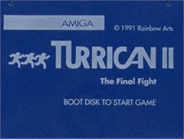 Top of cartridge artwork for Turrican II: The Final Fight on the Commodore Amiga.