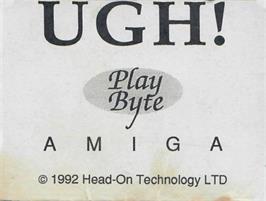 Top of cartridge artwork for Ugh! on the Commodore Amiga.