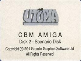 Top of cartridge artwork for Utopia - The Creation Of A Nation on the Commodore Amiga.