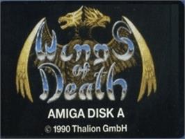 Top of cartridge artwork for Wings of Death on the Commodore Amiga.