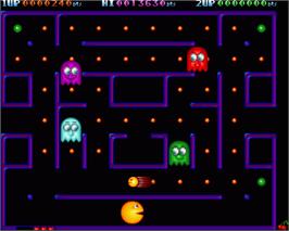In game image of Deluxe Pac-man on the Commodore Amiga.