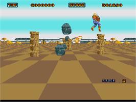 In game image of Space Harrier on the Commodore Amiga.