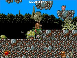 In game image of Chuck Rock on the Commodore Amiga CD32.