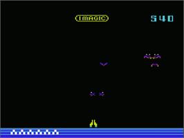 In game image of Demon Attack on the Commodore VIC-20.