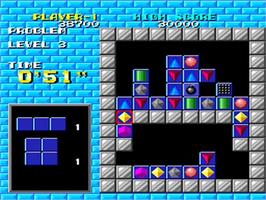 In game image of Puzznic on the NEC TurboGrafx-16.