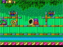 In game image of Pop'n Magic on the NEC TurboGrafx CD.