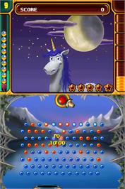 In game image of Peggle - Dual Shot on the Nintendo DS.