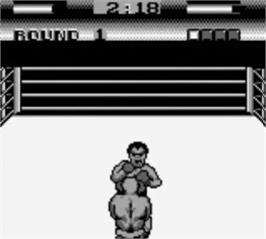 In game image of George Foreman's KO Boxing on the Nintendo Game Boy.