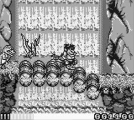 In game image of Joe & Mac: Caveman Ninja on the Nintendo Game Boy.