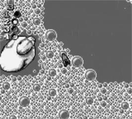 In game image of Micro Machines on the Nintendo Game Boy.