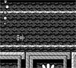 In game image of Micro Machines 2 - Turbo Tournament on the Nintendo Game Boy.