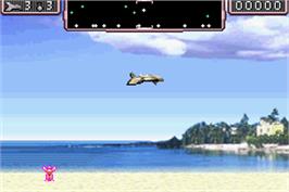 In game image of Defender on the Nintendo Game Boy Advance.
